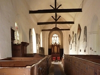 Interior St James Church. Limewash walls and very high pews. The organ dates to 1864.