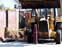 Clearing up the mess. Apart from the bollard no damage was done. Roydon Road April 19th 2011