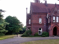 The side entrance to the well kept gardens.