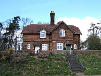South Lodge, Hollycross Road. Gatelodge containing 2 houses: Possibly by Alfred Waterhouse who built the main house at Easneye for T R Buxton. Grade 2 listed. Photo 2007