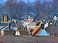 Stanstead Abbotts roof tops just after the sun had melted the morning frost. The roof in the centre of the photo is "Walford House", 35 High Street. Photo 1973, taken from the fields behind Chapelfields.