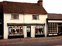 High Street Stanstead Abbotts. Barnardos charity shop. Formerly a hairdressers. The building to the right was the doctors surgery. Photo 1985.