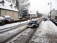 High Street. A brave motorist tackles the harsh conditions. Photo Feb 2010.