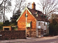 This house in Stanstead Abbotts, 77 High Streeet, (opposite Riverside), used to belong the Roman Catholic Church. A wooden hut in the grounds was used as a church for celebrating Mass. After the church stopped using the site the house was let out to a Mr Lovick but the house gradually fell into a poor state and became uninhabitable. Mr Lovick moved out in 1973 and the site was sold for redevolopement. (See next picture.) Photo 1983