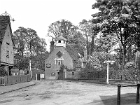 Clock House, Cappel Lane. The bridge can be seen but the stream is now "piped" and houses built on the reclaimed land behind the railings.
