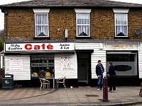 The cafe. Bacon sandwich, slice of toast and two teas cost me a fiver. Very nice it was too. 23 High Street. Shop next door empty. Used to be cleaners but they moved across the road.